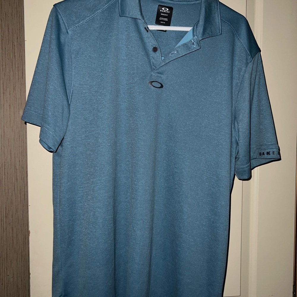 Oakley gorgeous teal colored polo shirt L
